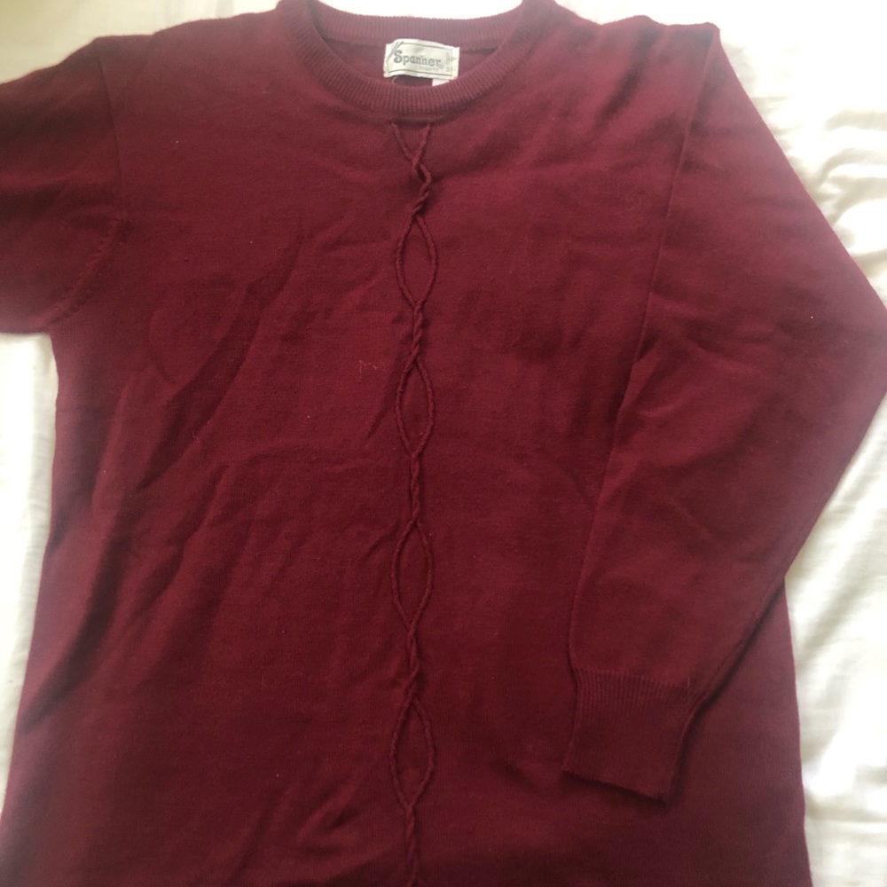 Burgundy sweater with detailing down the front